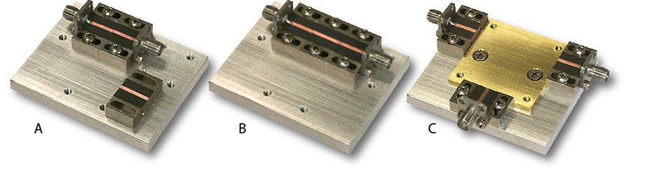Drop-in test fixtures: A, first transmission line measurement; B, second through line inserted; C, ready for testing units.
